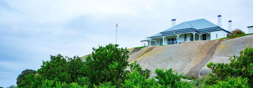 The light house keeper's cottage sitting atop one of the massive rock formations on Montague Island