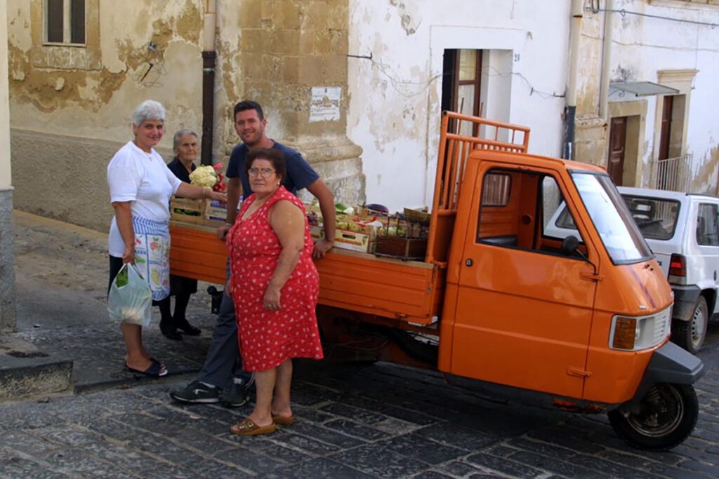 The local grocer brings fresh produce to your door in Noto, Sicily.