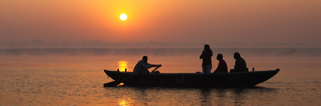 A boat on the Ganges River in Varanassi at sunrise