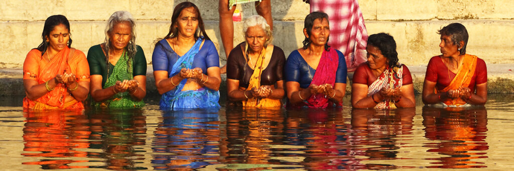 A group of women in a ritual bathing in the Ganges River.